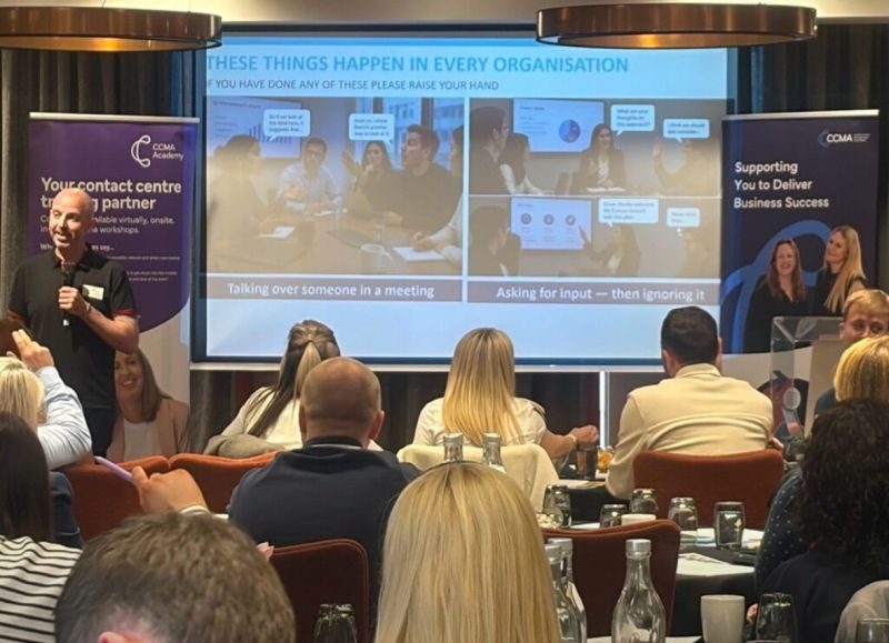 Lee Houghton delivering his culture talk to a room of leaders at round tables